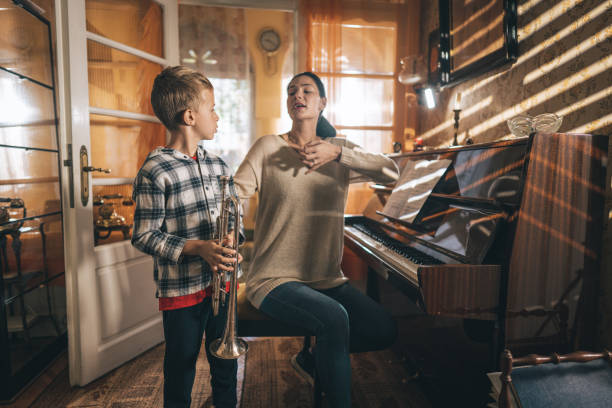 istock Boy learning to play trumpet 1450286776