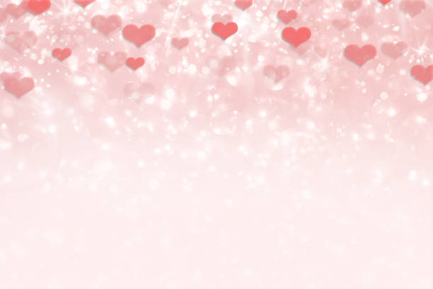 Pink shiny glittery heart background for Valentine's Day stock photo