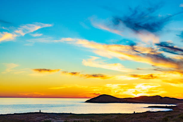 Sunset over sea. Seaside evening landscape. Calblanque Beach, Murcia Spain.