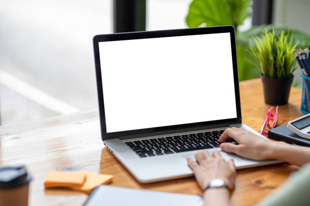 istock female hand typing computer on desk in office. 1450290707