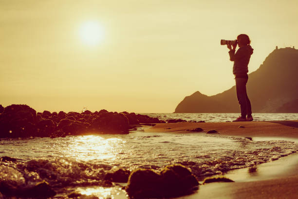 istock Woman with camera on Monsul beach, Spain 1450291757