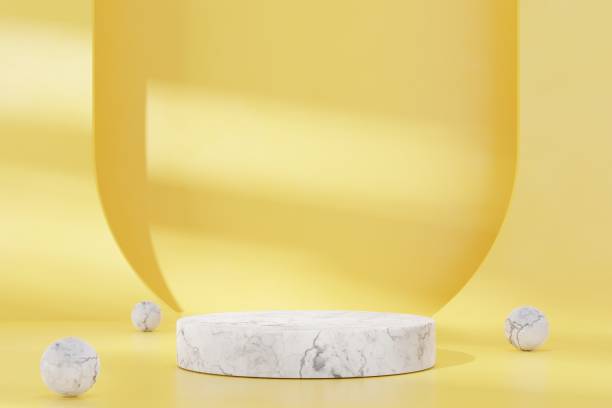 istock White marble stone podium on yellow abstract background. 3D render graphic design. 1450293658