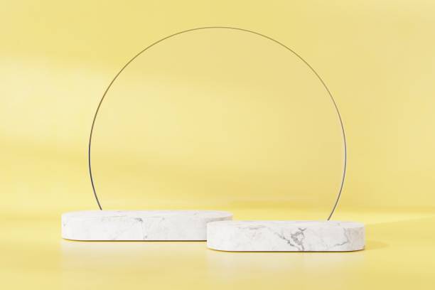 istock White marble stone podium on yellow abstract background. 3D render graphic design. 1450293697