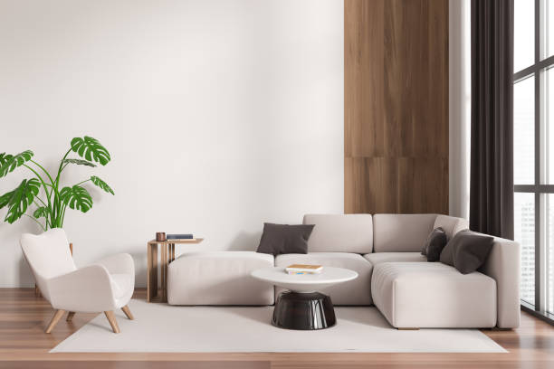 istock Front view on bright living room interior with sofa, armchair 1450293903