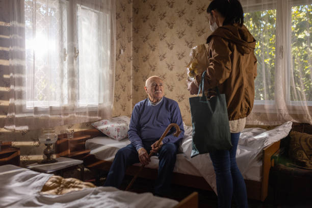istock Daughter visiting father in nursing home 1450294341