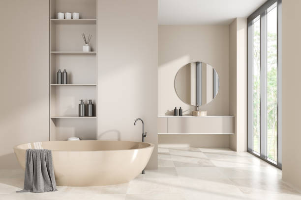 istock Light hotel bathroom interior with tub and sink, panoramic window 1450294342