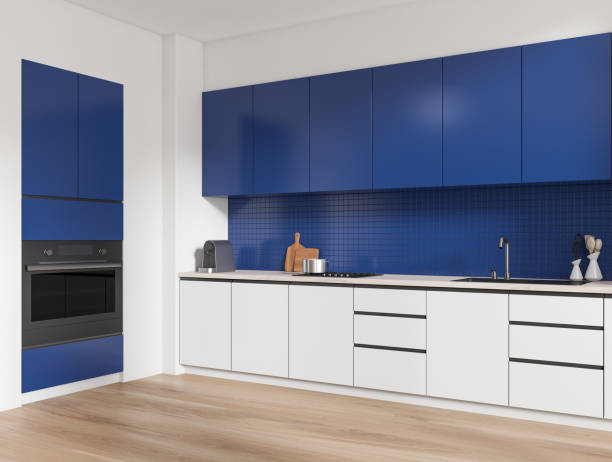 istock Blue kitchen interior with shelves and kitchenware, cooking area 1450294392