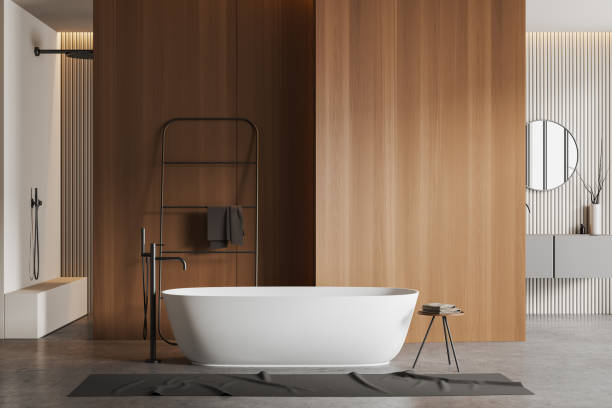 istock Front view on bright bathroom interior with bathtub, shower, sink 1450294684