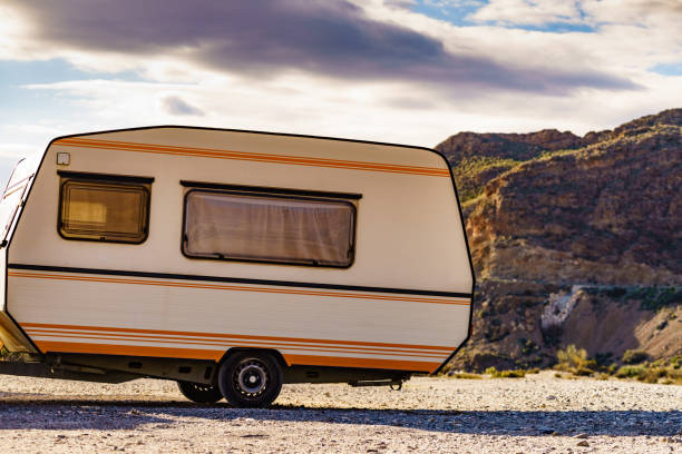 istock Caravan trailer in mountain nature 1450295648