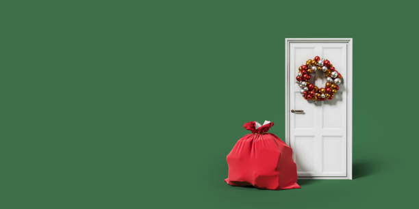 istock Red bag and christmas wreath on the door, copy space 1450295754