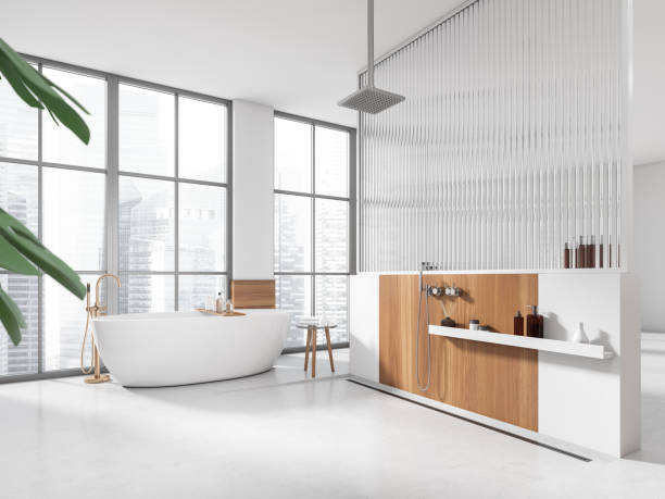 istock Corner view on bright bathroom interior with bathtub, panoramic window 1450295878