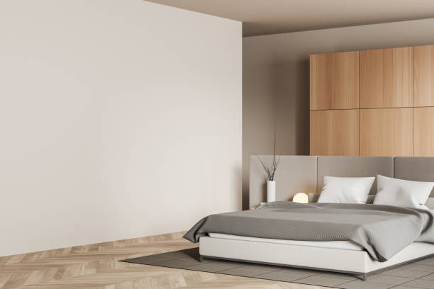 istock Light bedroom interior with bed and decoration. Mockup wall 1450296105