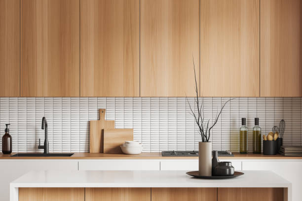 istock Stylish kitchen interior with bar countertop, kitchenware and decoration 1450296193
