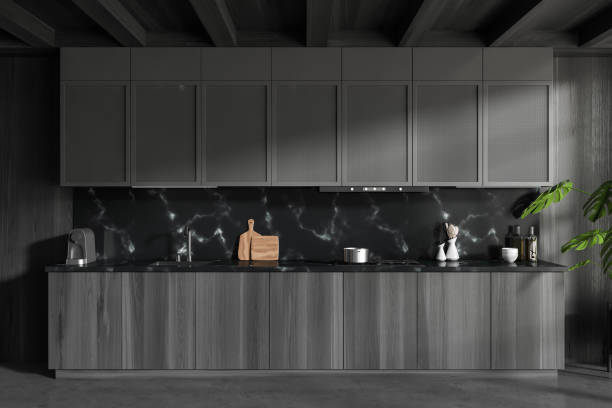 istock Grey kitchen interior with hidden shelves and minimalist kitchenware 1450296245