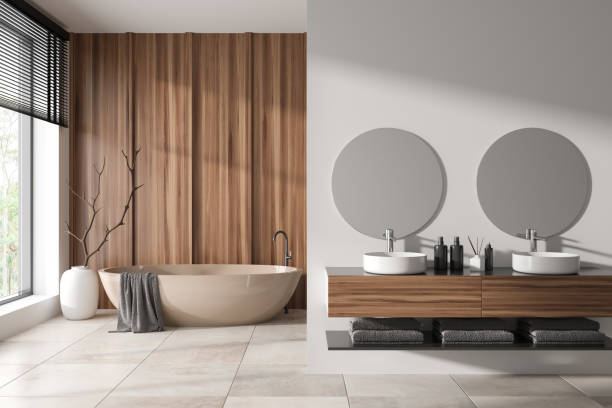 istock Elegant bathroom interior with washbasin and tub, panoramic window. Copy space 1450296852