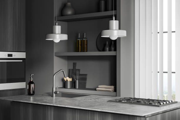 istock Grey kitchen interior with bar countertop and kitchenware, jalousie and window 1450296981