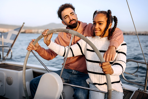Father and daughter sailing together