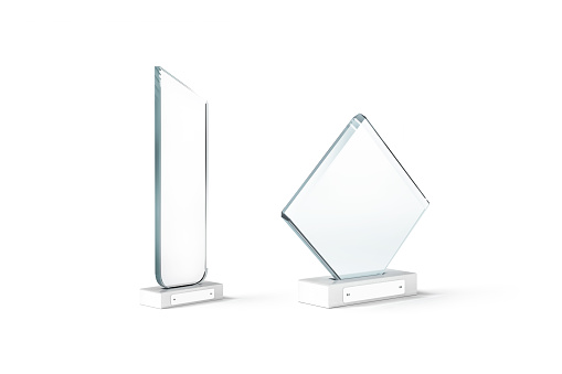 Blank glass manhattan and rhombus shape award mockup, isolated, 3d rendering. Empty plexiglass champion trophies mock up, side view. Clear champion reward cup for laureate template.