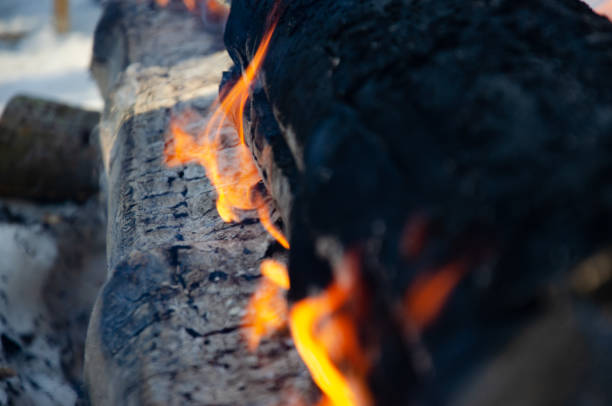 a long and weakly burning, smoldering fire made of logs. High quality photo