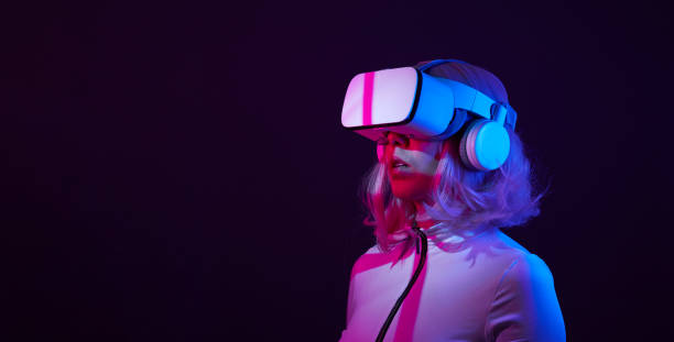 istock Woman in virtual reality goggle in neon colors. 1450303487