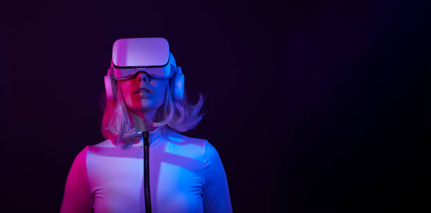 istock Woman in virtual reality goggle in neon colors. 1450303977