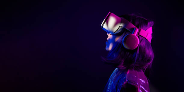 istock Woman in virtual reality goggle in neon colors. 1450304046