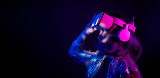 istock Woman in virtual reality goggle in neon colors. 1450304105