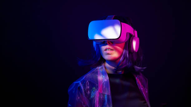 istock Woman in virtual reality goggle in neon colors. 1450304346