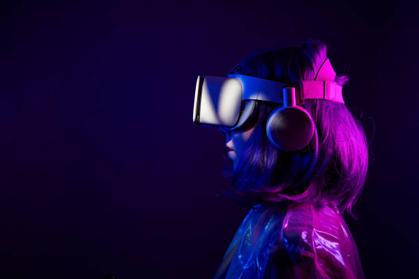 istock Woman in virtual reality goggle in neon colors. 1450305146