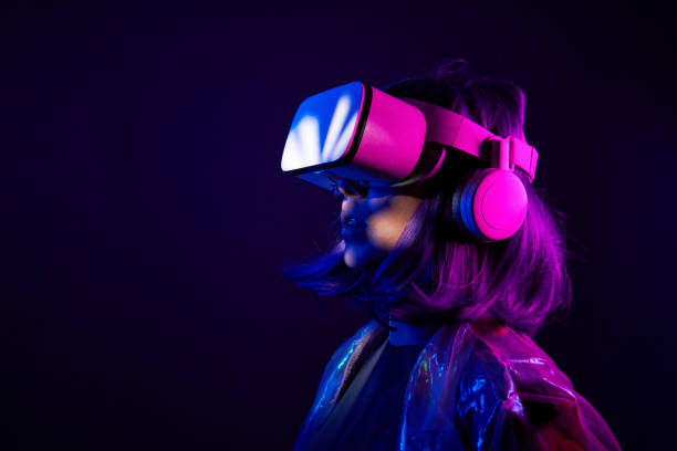 istock Woman in virtual reality goggle in neon colors. 1450305266