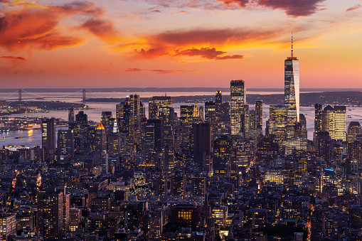 An aerial image of the Manhattan skyline at night in New York.