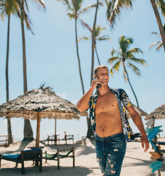 istock young digital nomad man at sea traveling with a computer 1450305814