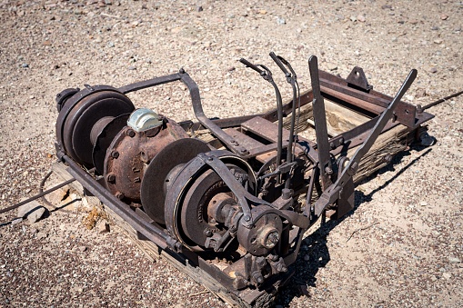 Detail of an old cable and belt traction system abandoned in the desert