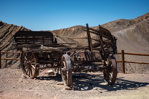Old abandoned traditional wooden carriage in Calico - ghost town and former mining town in San Bernardino County - California, United States - Old west concept