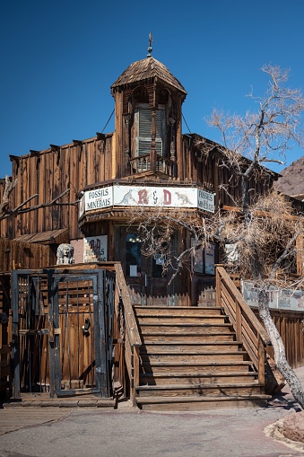 Yermo, United States – August 03, 2022: Old Wild West frame house with a nice bamcony in the corner