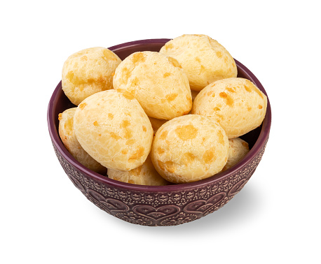 Typical brazilian cheese bun in a bowl isolated over white background.
