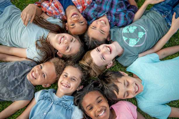 istock Kids Laying in a Circle Outside 1450308532