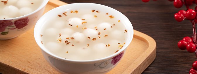 Little sweet osmanthus soup white tangyuan with decoration with fu word means good fortune.