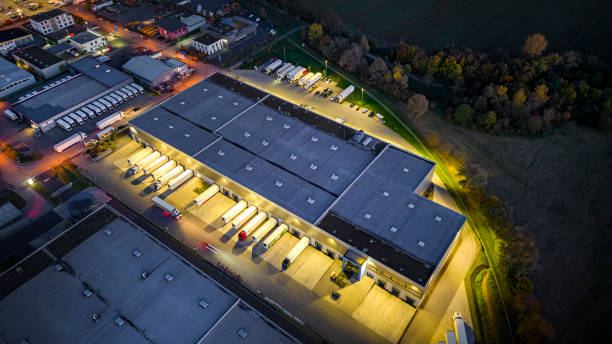 istock Distribution warehouse at dusk - aerial view 1450310952