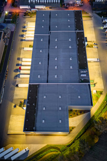 istock Distribution warehouse at dusk - aerial view 1450310987