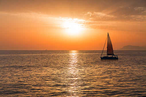 Sailboat Sailing at Sunset