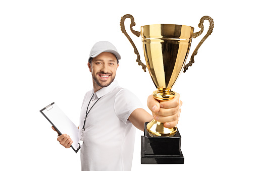Sports coach winning a gold trophy cup isolated on white background