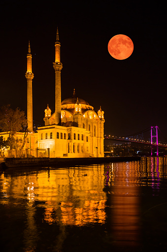 Ortakoy Mosque at Istanbul at Night with Red Moon