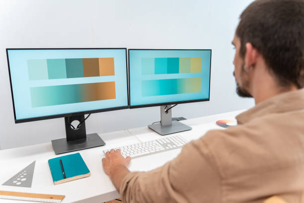 istock Young Handsome creative designer entrepreneur Male Working from Home on Desktop Computer. 1450322248