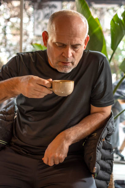 istock Handsome man drinking cup of coffee 1450325154