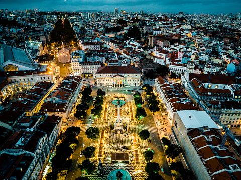 Drone view of Rossio Square at night in Lisbon city center, Portugal, Europe.