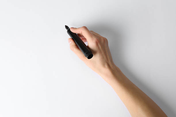 istock Woman holding black marker on white background, top view. Space for text 1450326446