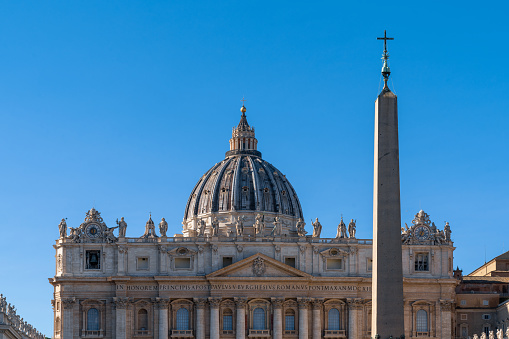 Vatican, October 07 -- A detailed view of the majestic facade of the St. Peter's Basilica with the monumental Michelangelo's dome. In the foreground, the statues of religious figures and popes that adorn Bernini's colonnade and a portion of the Apostolic Palace (right). The Basilica of St. Peter's, in the Vatican, is the center of the Catholic religion, one of the most visited places in the world and in Rome for its immense artistic and architectural treasures. In 1980 the historic center of Rome was declared a World Heritage Site by Unesco. Image in high definition format.