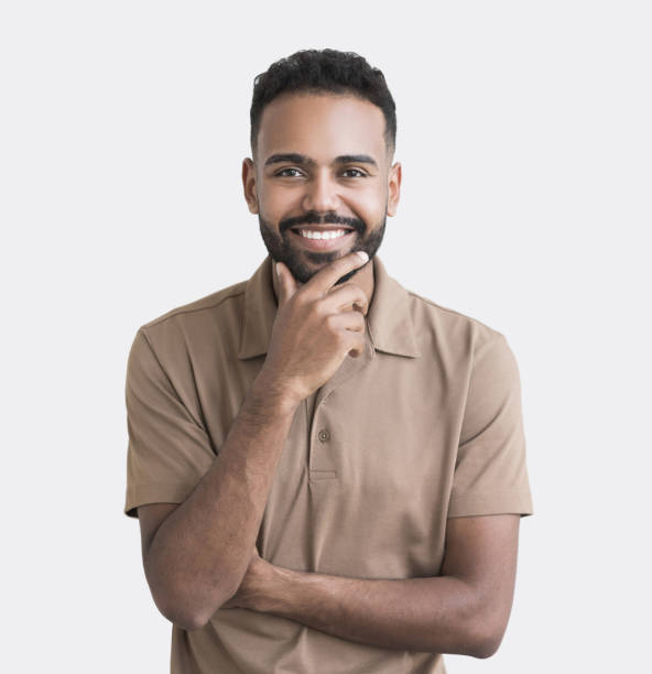 istock Studio portrait of handsome smiling young man 1450326523