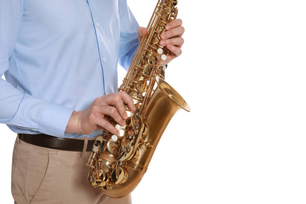 istock Man with saxophone on white background, closeup 1450326645